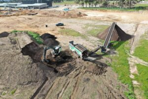 Treated material is transferred from the trommel to the treated stockpile via conveyor and is then ready to be flat-topped