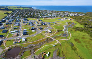 An aerial image shows The Cape’s restoration of the natural environment progressing alongside the residential construction (Image: Alan Foon)