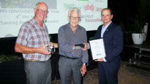 Tony VanderStaay (L) and John Messina congratulate Peter Waugh (Centre) on his prestigious award
