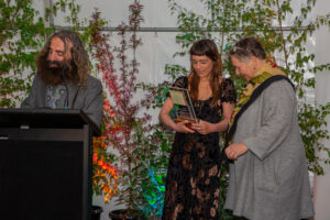 Jasmine (centre) receiving her award from Kate Low (right), TAFE NSW Director (Image: Australian Institute of Horticulture)