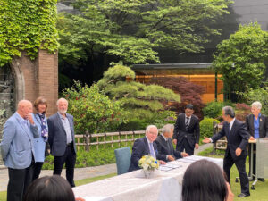 Members of both organisations signing the document (Image: AGC)