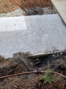 Planning ahead, a large conduit or pipe placed under a concrete path will help with future irrigation or lighting installation (Image: Patrick Regnault)