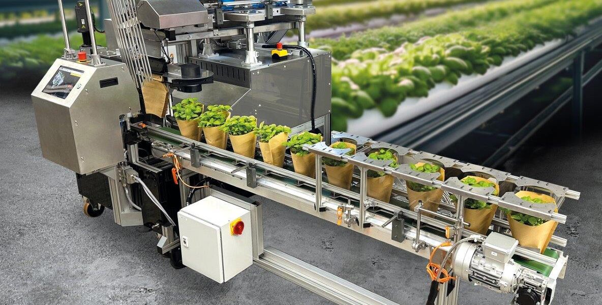 German firm Weber Verpackungen presented a packaging machine for potted plants that claims productivity increases up to 100% compared with manual hand packing