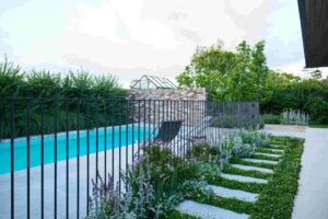 This colourful planting surrounding the pool offers serenity and style (image supplied by Nick Bowers)