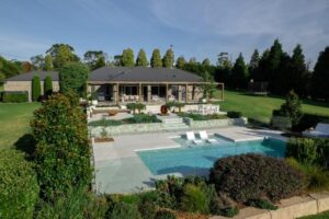 Magnolia trees and Sweet Viburnum frame the new pool area, providing both a visual statement and practical windbreak