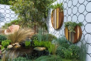 Angophora costata at the rear with recycled timber vertical planters above the custom three-tier pond (Image: Brent Wilson)