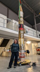 Associate Professor Jenny Mortimer beside the MAPHEUS 15 sounding rocket (Image: Plants for Space/University of Adelaide)