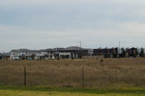 A typical Australian new housing situation. What's missing apart from the trees? Shade, cooling, wildlife habitat, general amenity. Some parts of the land development industry admit they can do better. Would a new Urban Greening study discipline help? (Images supplied by John Fitzsimmons)