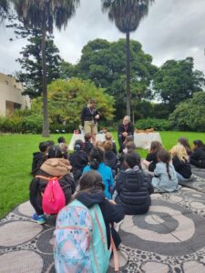 Education facilitator and local artist Claire Mosley working with the ‘Young Botanists’ and Dr Tom May, Principal Research Scientist (Mycology), at Royal Botanic Gardens Victoria (Image: RBGV)