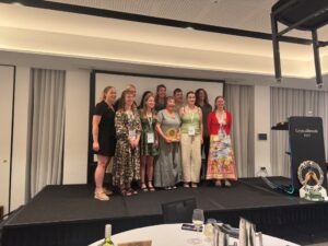 Di Larkman, winner of the Edward and Mary Bunker Award, surrounded by Zoe Williams, the Six Pack and the South African exchange students (image supplied by