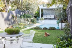 The new rear garden includes a hardy lawn area of TifTuf grass, pool and cabana, framed by rows of Waterhousea floribunda (weeping lilli pilli) around the boundaries of the garden to ensure privacy