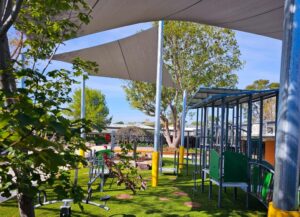 Shade sails have been used to provide instant shade, with trees used to provide future canopy and shade (Image: Botanical Traditions Pty Ltd)