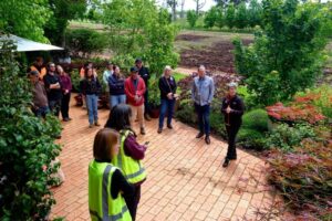Leanne Gillies and Daniel Jansen from Fleming’s Nurseries speak to participants on the NGIV bus tour (Image: Ludovic Vilbert, Inwardout Studio)