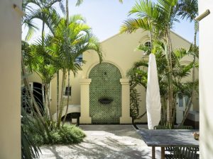 An arch becomes a stunning feature, introducing detailed hand-made mosaics and a copper water feature creating a sense of calm and character